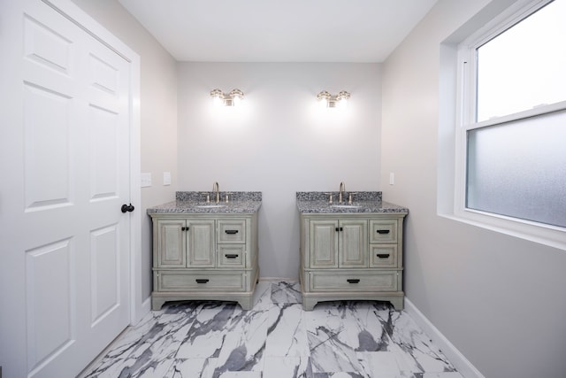 bathroom with vanity and a wealth of natural light