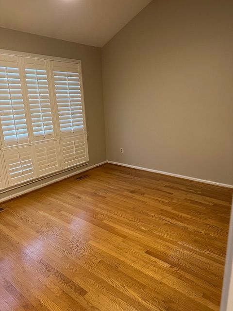 spare room with light wood-type flooring