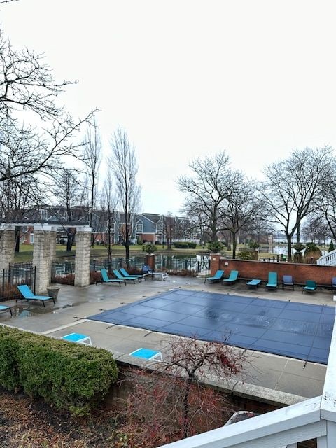 view of swimming pool with a patio area