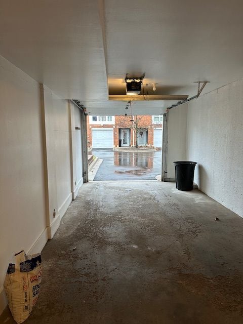 unfurnished living room with concrete flooring