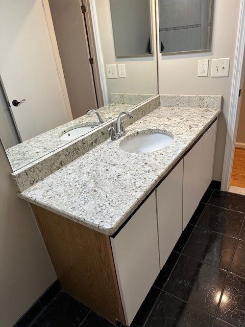 bathroom with tile patterned floors and vanity