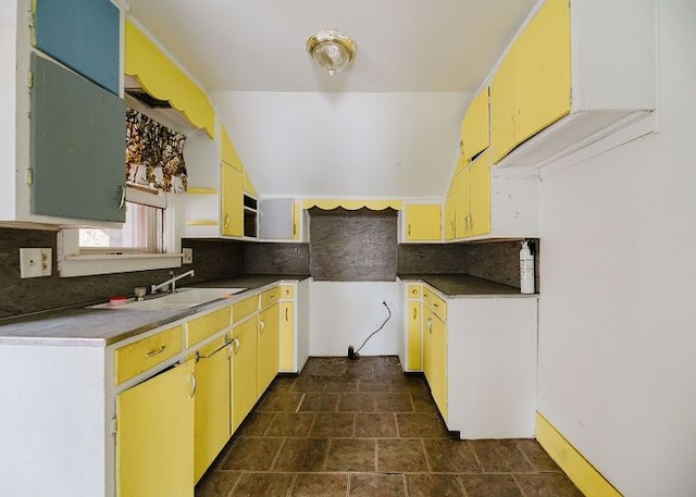 kitchen featuring decorative backsplash and sink