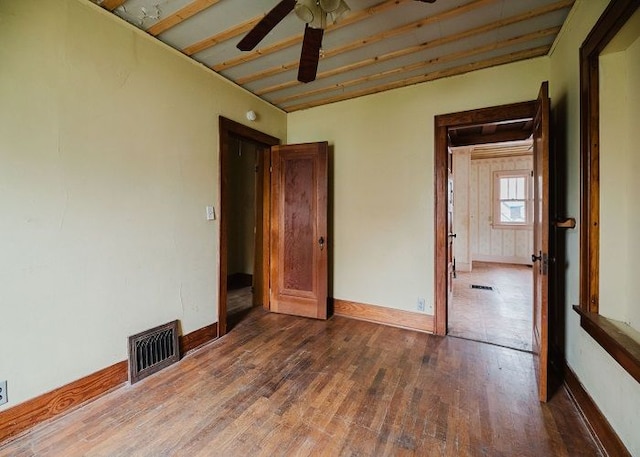 unfurnished bedroom featuring hardwood / wood-style flooring and ceiling fan