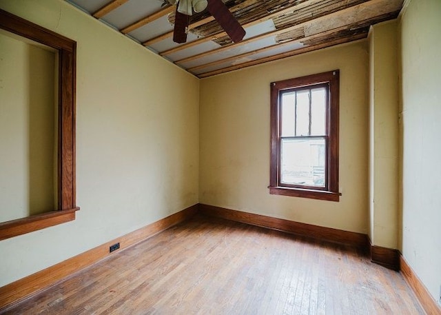 empty room featuring ceiling fan and hardwood / wood-style flooring