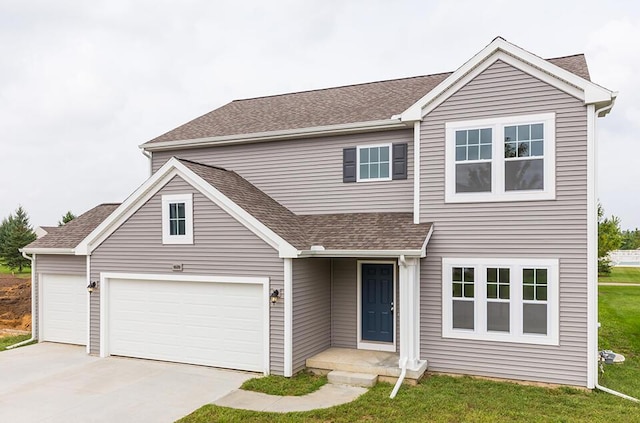 traditional home featuring a garage, a front yard, roof with shingles, and driveway