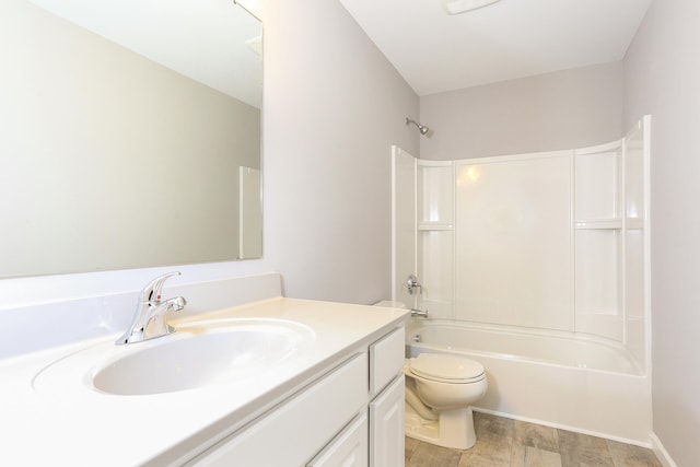 full bathroom featuring toilet,  shower combination, and vanity