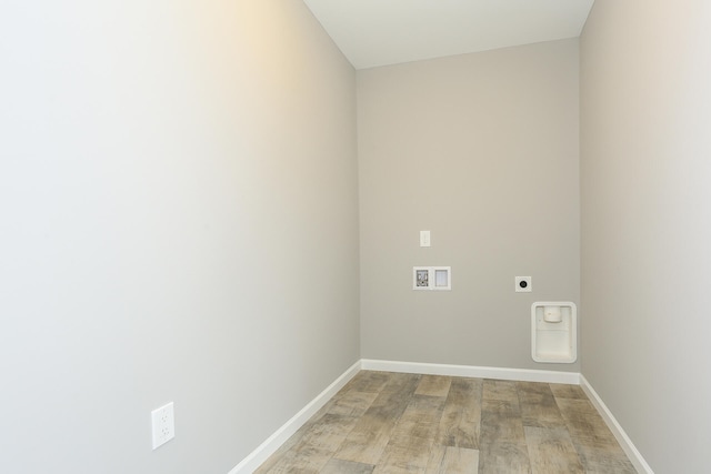 laundry room with washer hookup, hookup for an electric dryer, light wood-type flooring, laundry area, and baseboards