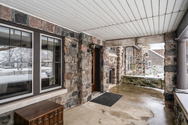 view of snow covered property entrance