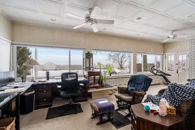 home office featuring light carpet and ceiling fan