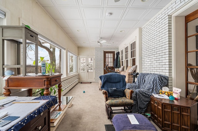 sunroom / solarium with ceiling fan