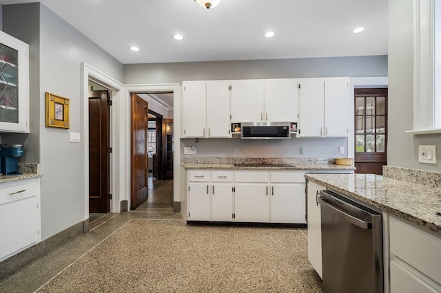 kitchen featuring light stone countertops, white cabinets, and appliances with stainless steel finishes