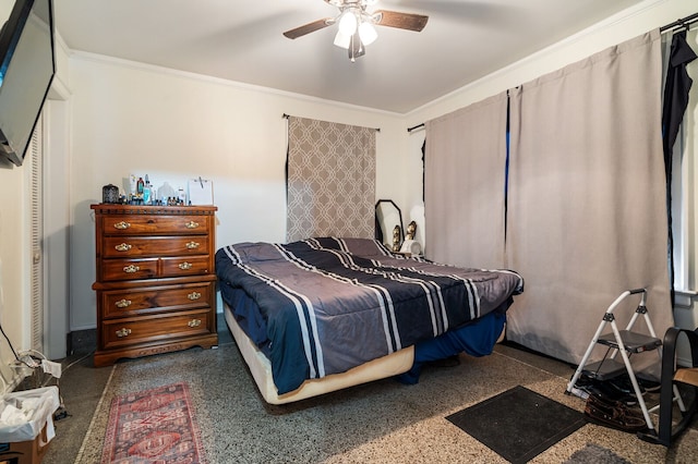 bedroom with a closet, ceiling fan, and crown molding