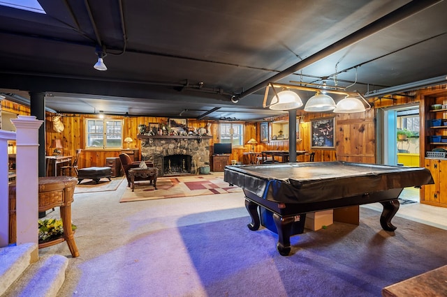 playroom featuring a fireplace, carpet floors, wooden walls, and billiards