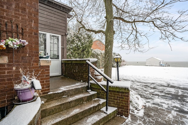 view of snow covered property entrance