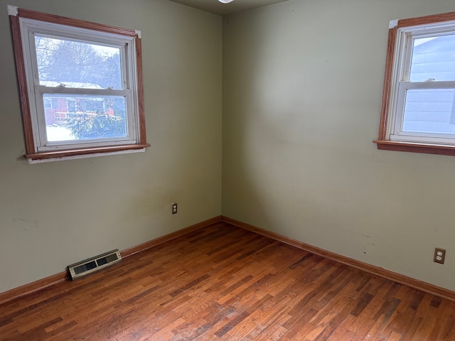 spare room featuring hardwood / wood-style flooring