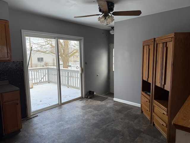 unfurnished living room featuring ceiling fan