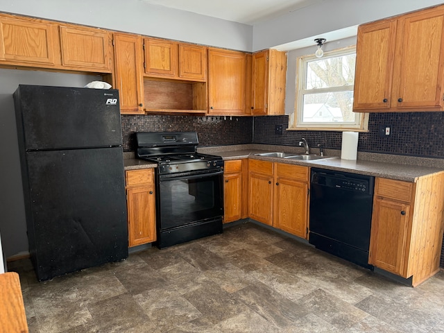 kitchen with sink, tasteful backsplash, and black appliances