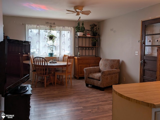 dining room featuring dark hardwood / wood-style floors and ceiling fan