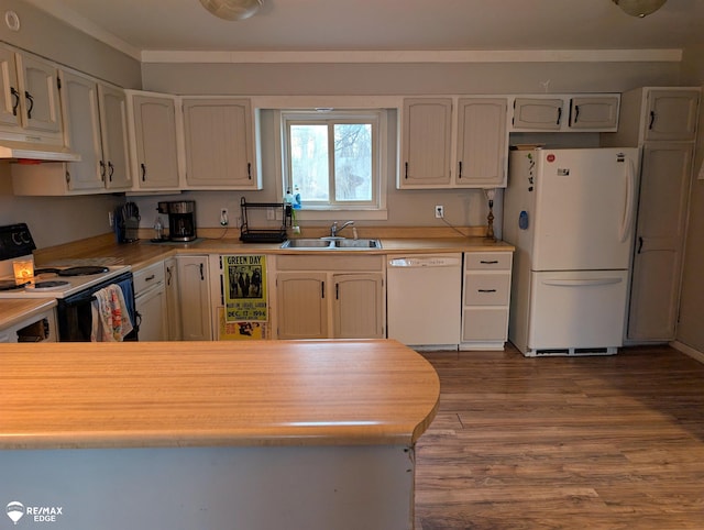 kitchen with wood-type flooring, white appliances, white cabinetry, and sink