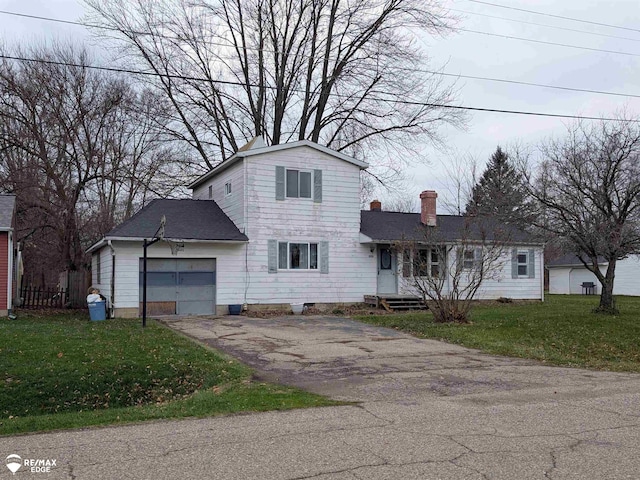 front facade with a garage and a front yard