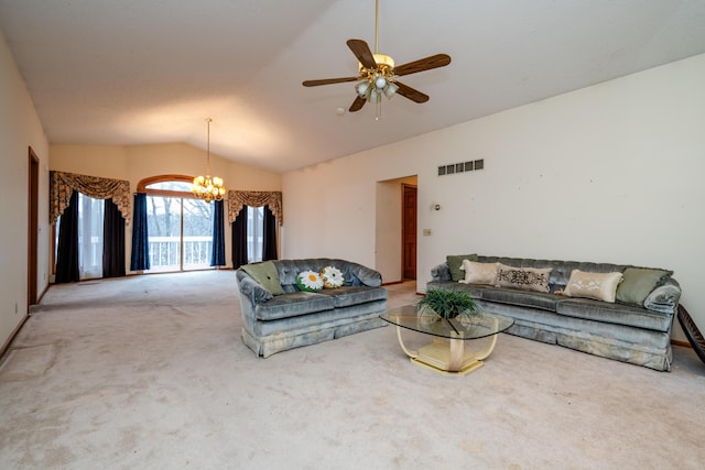 living room with carpet, ceiling fan with notable chandelier, and vaulted ceiling