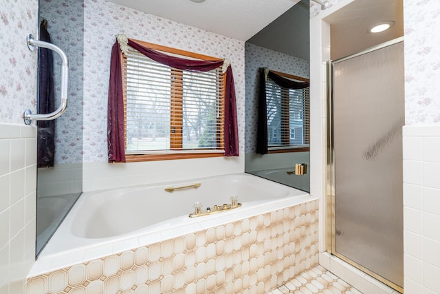 bathroom featuring shower with separate bathtub, a textured ceiling, and tile patterned floors