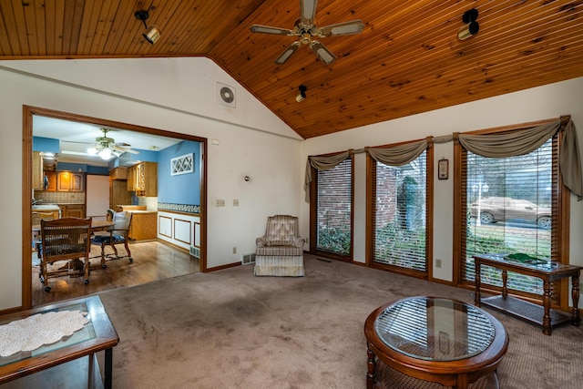 living room featuring ceiling fan, high vaulted ceiling, wood ceiling, and hardwood / wood-style flooring