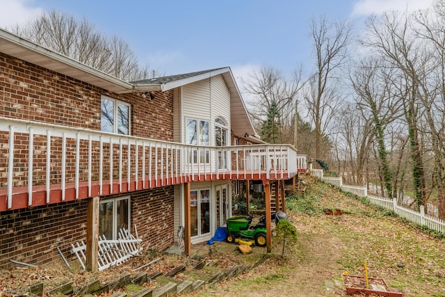 view of home's exterior with a wooden deck