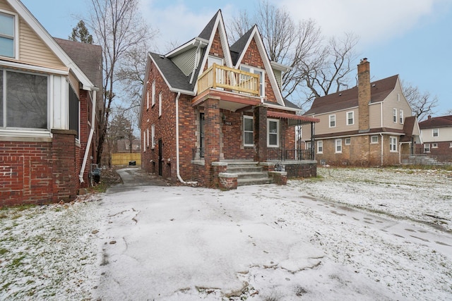 view of front of home with a balcony and a porch