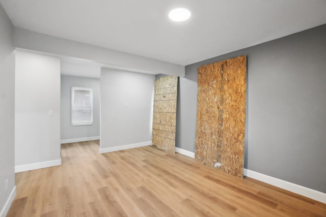 spare room with light hardwood / wood-style flooring