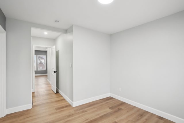 hallway with light hardwood / wood-style flooring