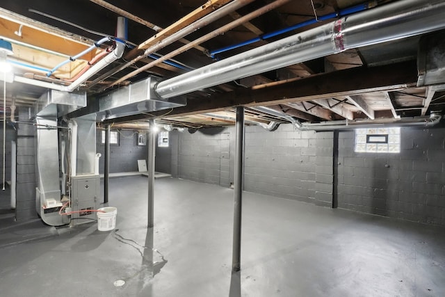 basement featuring heating unit