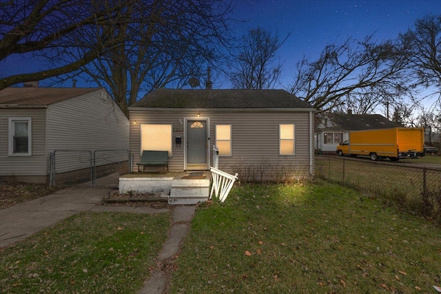 bungalow-style home featuring a yard