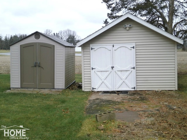 view of outbuilding with a lawn