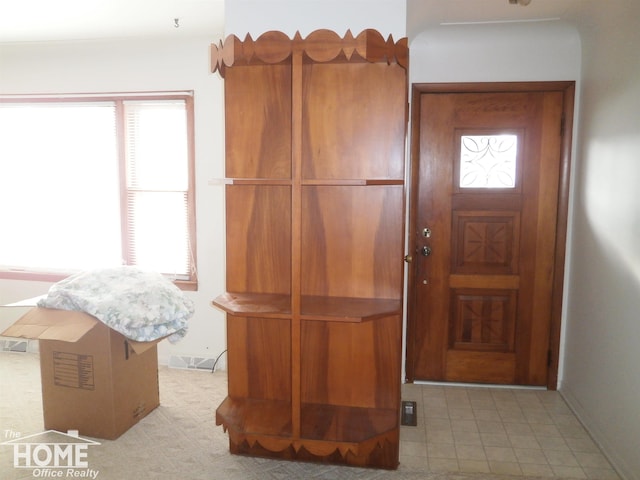 view of carpeted foyer