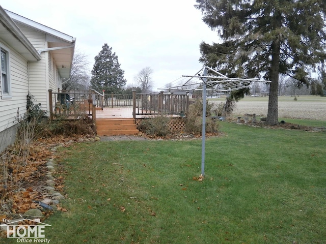 view of yard with a wooden deck