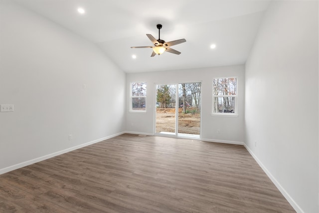 unfurnished living room with dark wood finished floors, vaulted ceiling, baseboards, and recessed lighting