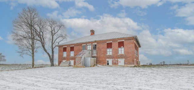 view of snow covered property