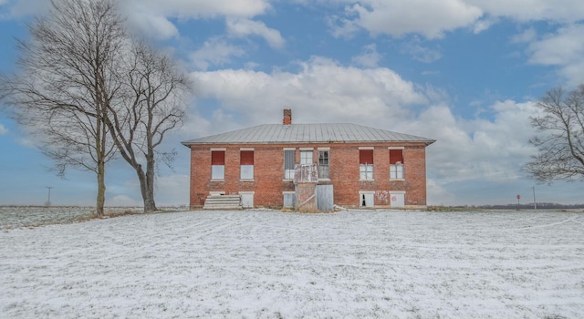 view of snow covered property