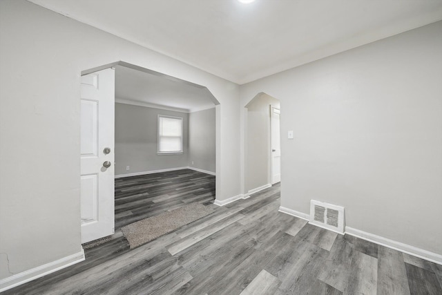 unfurnished room featuring hardwood / wood-style flooring