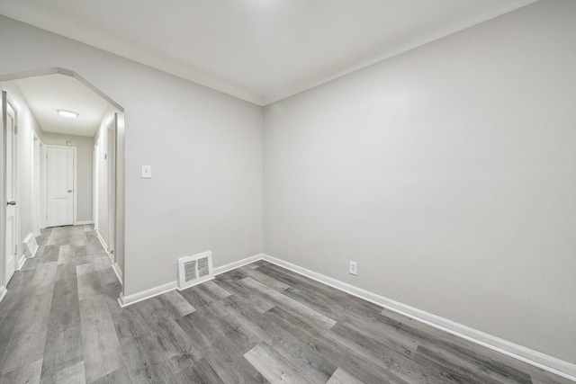 unfurnished room featuring hardwood / wood-style floors