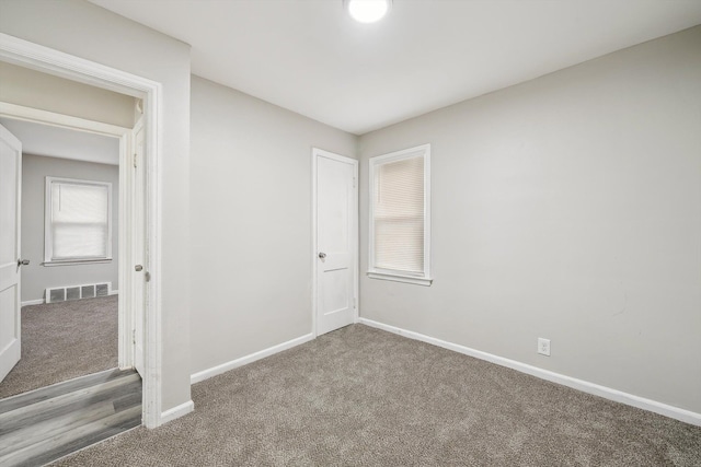 unfurnished room featuring carpet floors