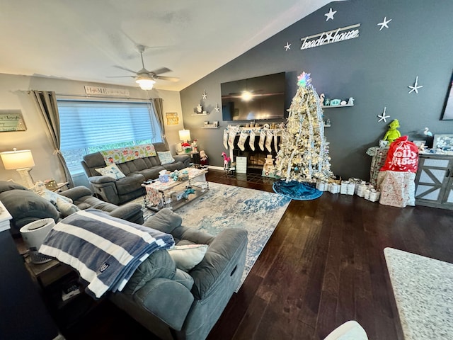 living room with ceiling fan, dark hardwood / wood-style flooring, and vaulted ceiling