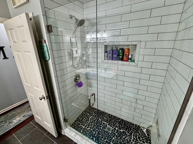 bathroom with tile patterned floors and an enclosed shower