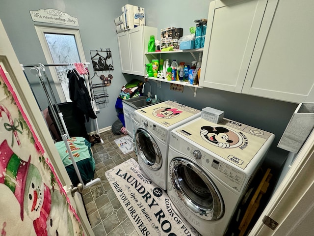 clothes washing area with cabinets, independent washer and dryer, and sink