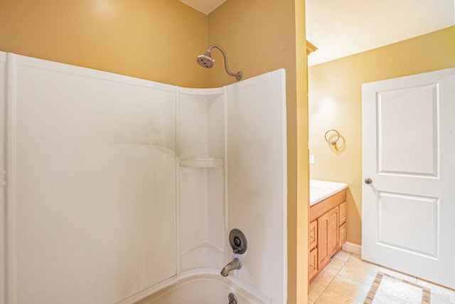 bathroom featuring vanity, tile patterned flooring, and bathing tub / shower combination