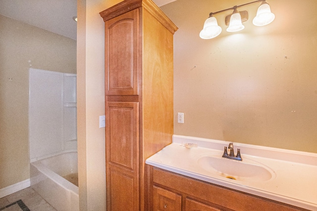 bathroom featuring vanity and a washtub