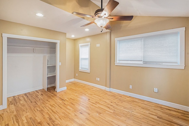 unfurnished bedroom with a closet, ceiling fan, and light wood-type flooring