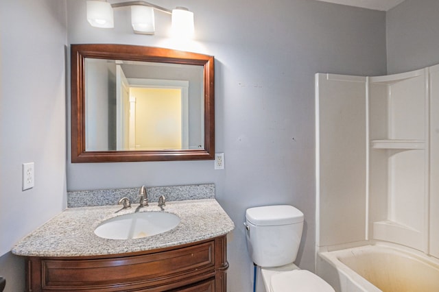 full bathroom with vanity, toilet, and  shower combination