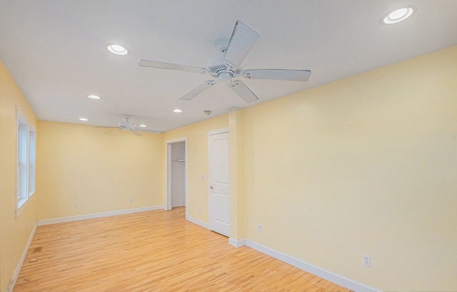 unfurnished room with ceiling fan and light hardwood / wood-style flooring